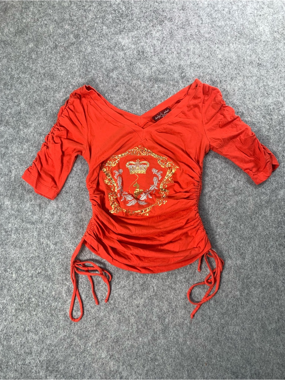 Vintage orange baby Phat Ruched V-Neck Top with Crest Graphic